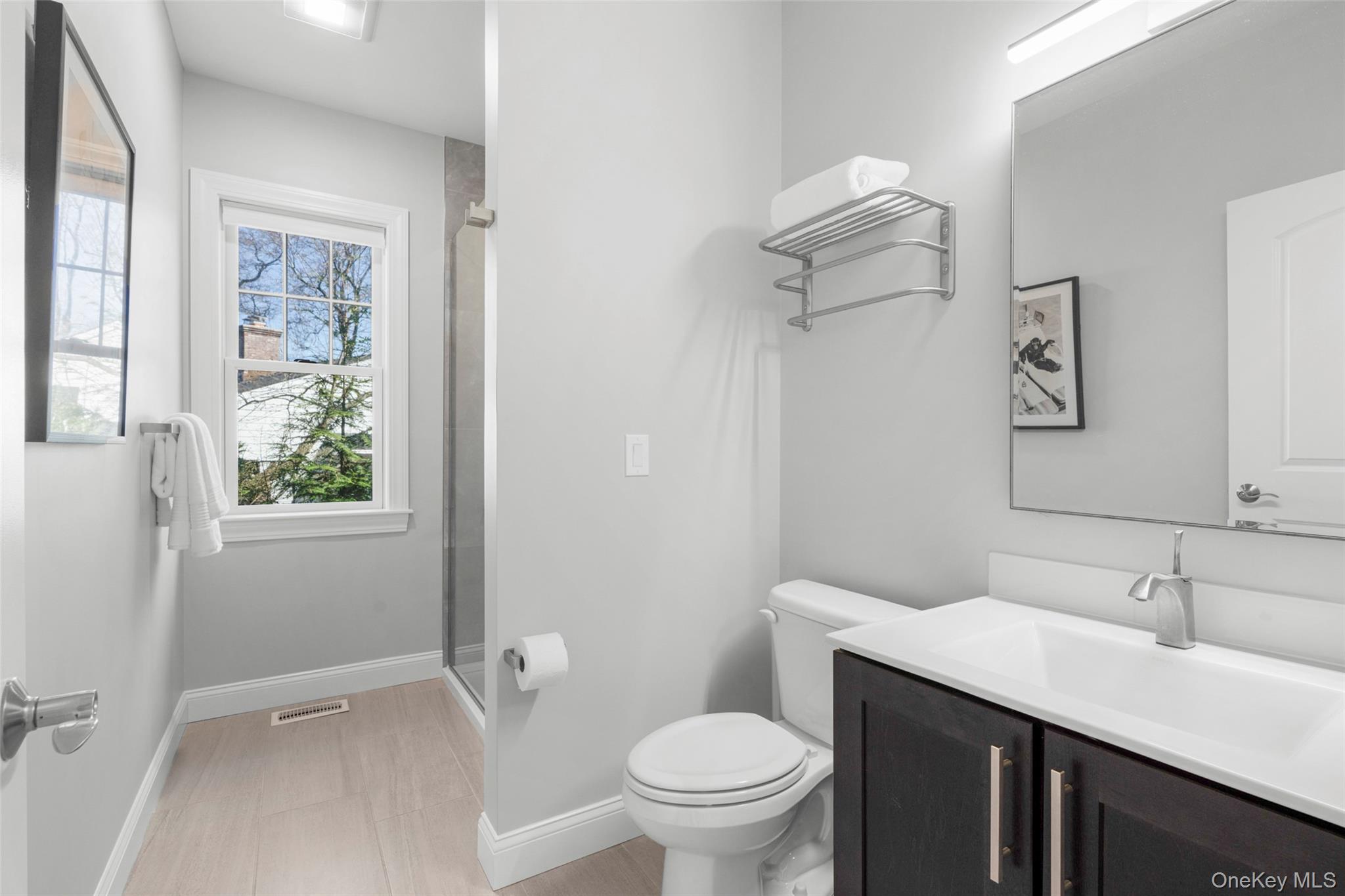 3 Robin Hill Road Scarsdale, NY 10583 - Photo 12 of 32 a bathroom with a sink a toilet and shower