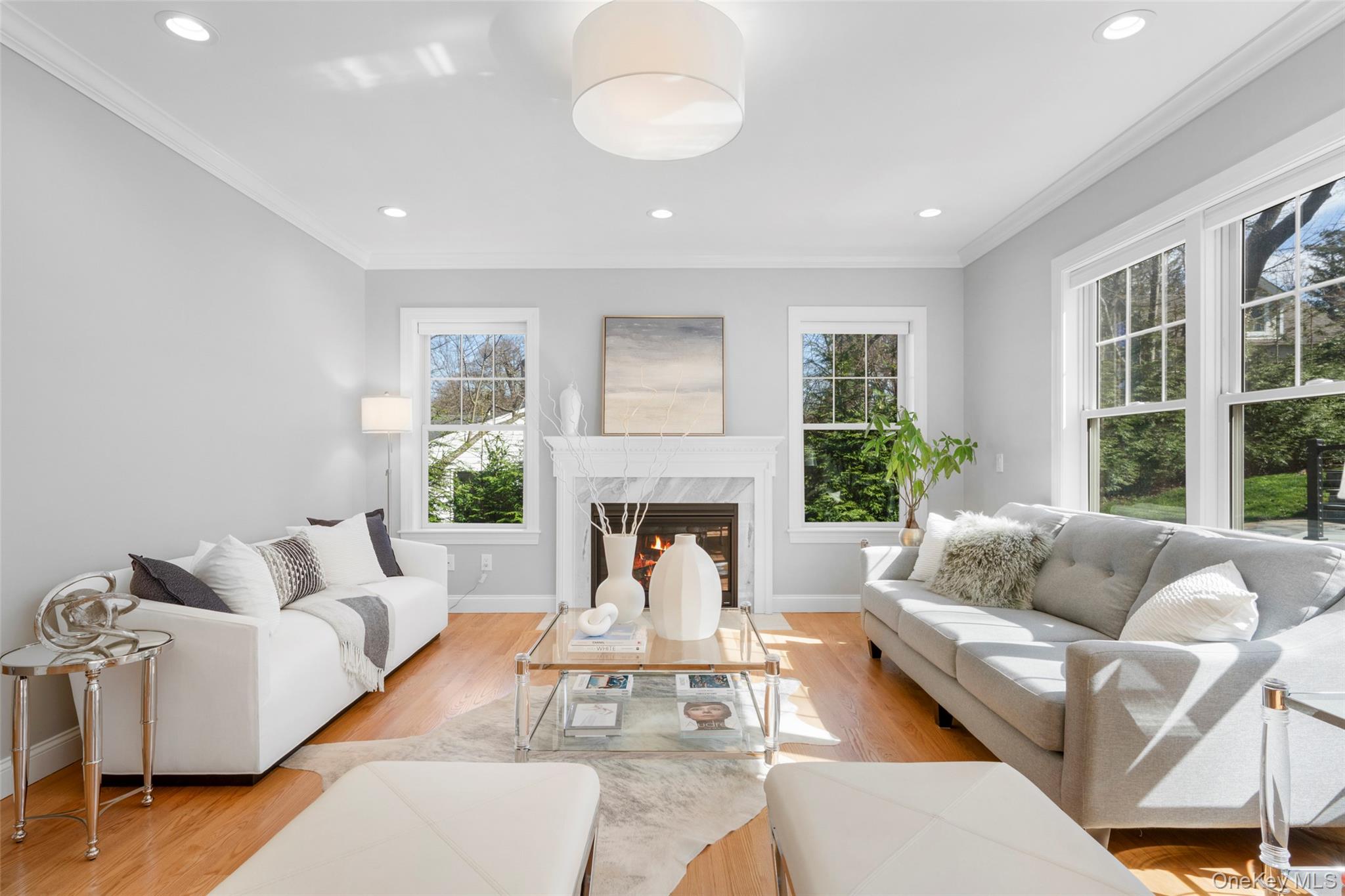 3 Robin Hill Road Scarsdale, NY 10583 - Photo 2 of 32 a living room with furniture fireplace and a large window