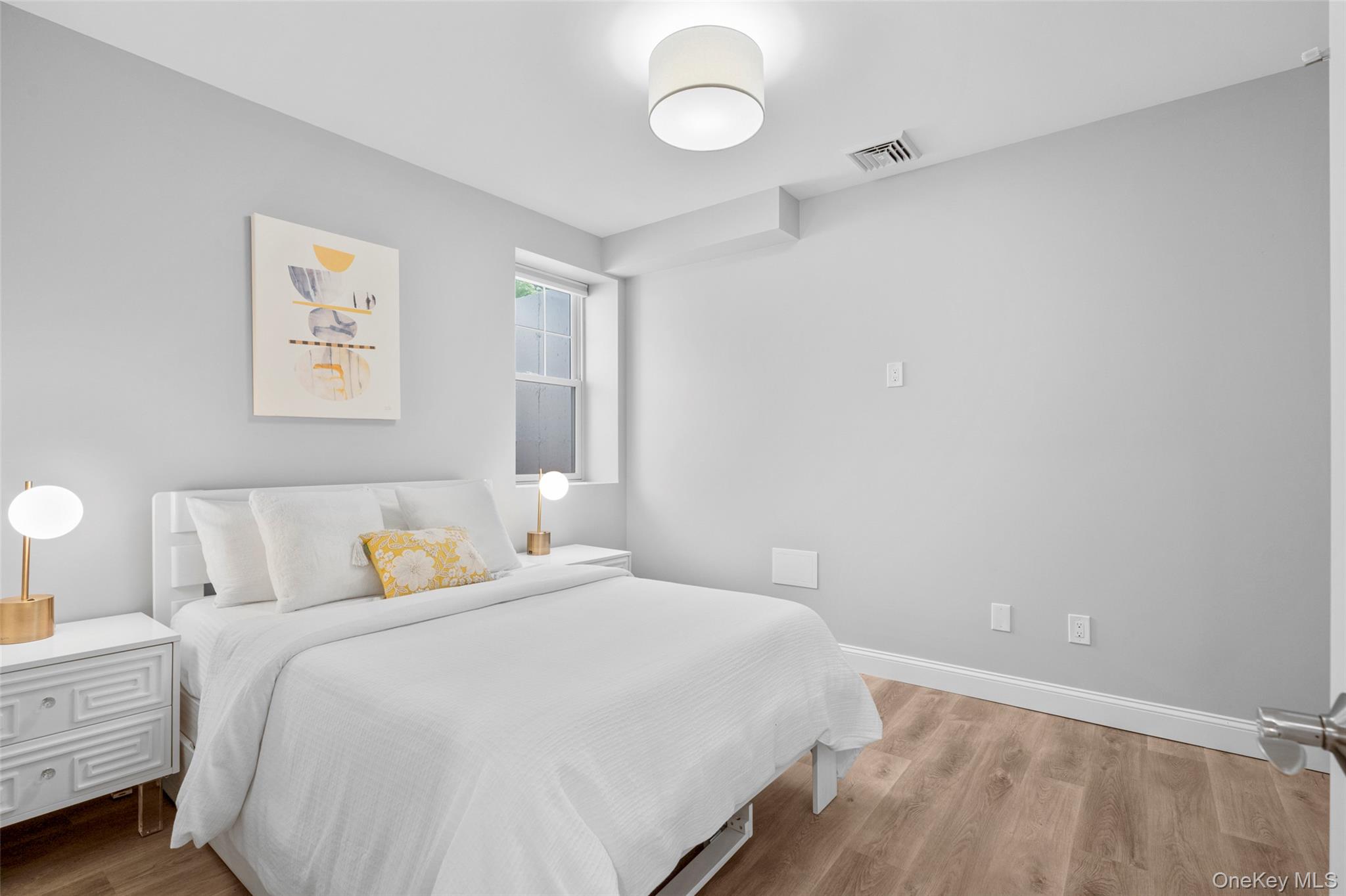 3 Robin Hill Road Scarsdale, NY 10583 - Photo 22 of 32 a bedroom with a bed and a window