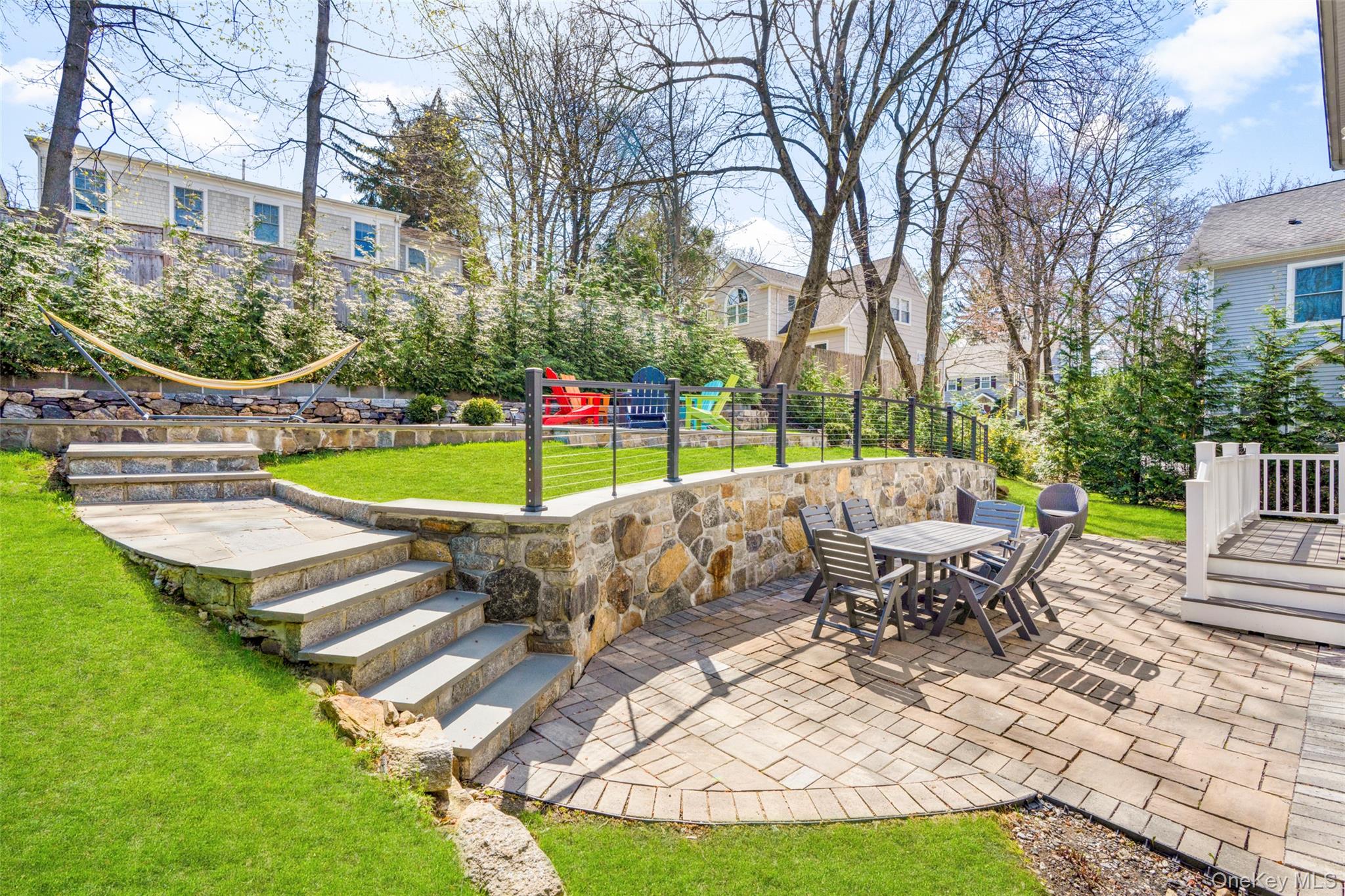 3 Robin Hill Road Scarsdale, NY 10583 - Photo 25 of 32 a view of a swimming pool with a lounge chair
