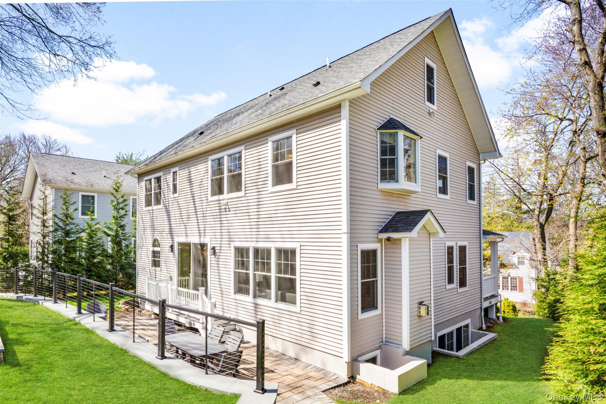 3 Robin Hill Road Scarsdale, NY 10583 - Photo 26 of 32 a front view of a house with yard and green space