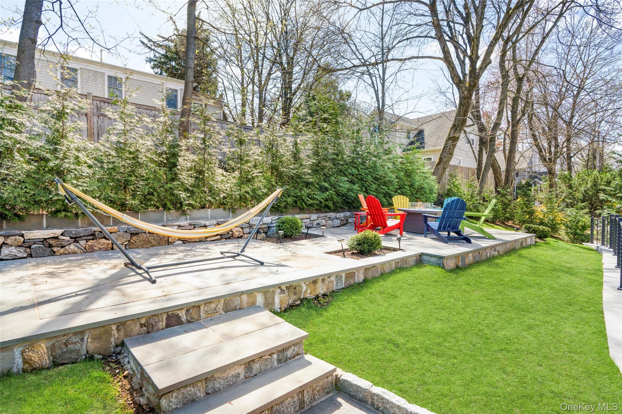 3 Robin Hill Road Scarsdale, NY 10583 - Photo 27 of 32 a view of a house with backyard porch and sitting area
