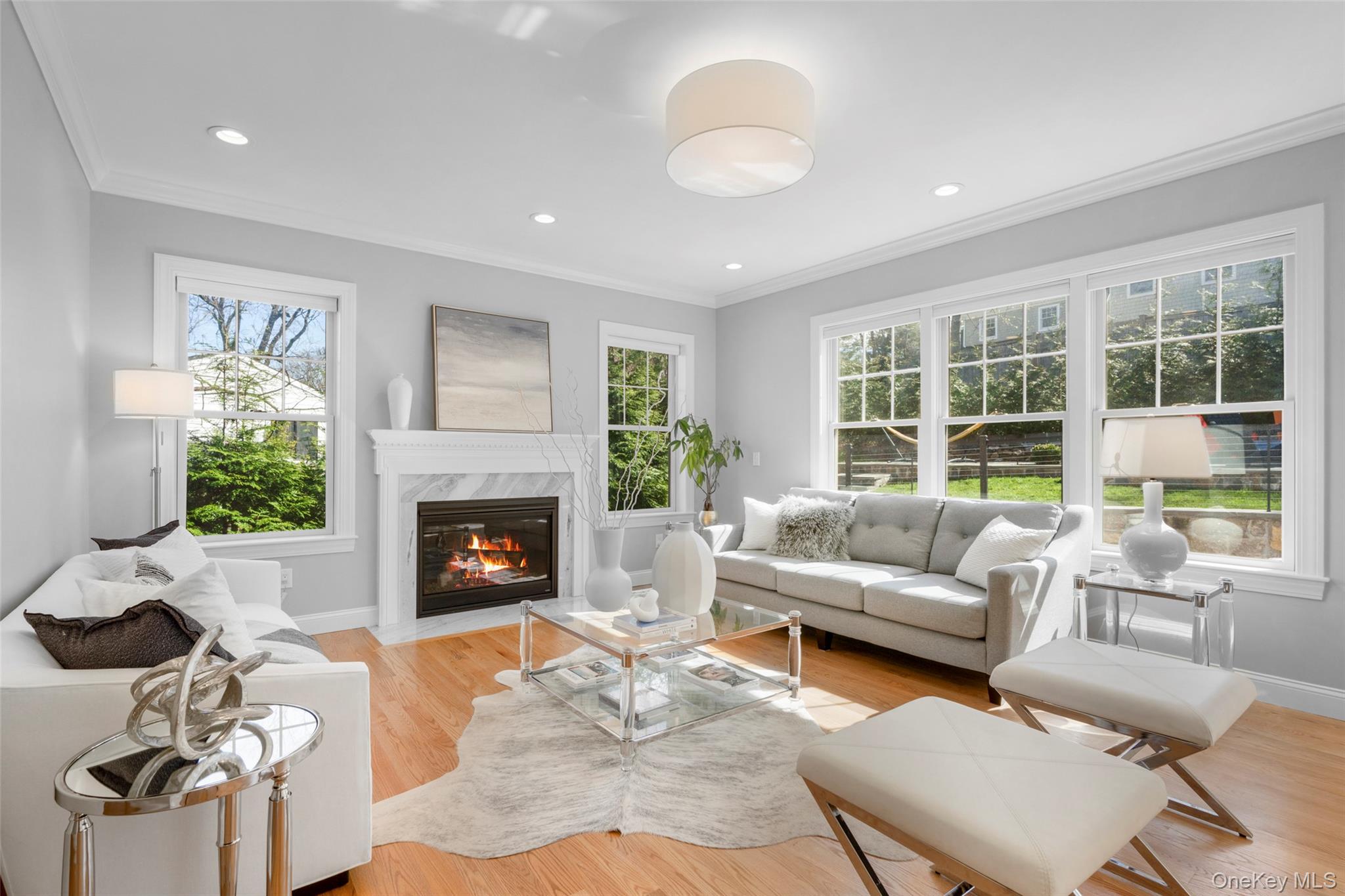 3 Robin Hill Road Scarsdale, NY 10583 - Photo 3 of 32 a living room with furniture and a fireplace