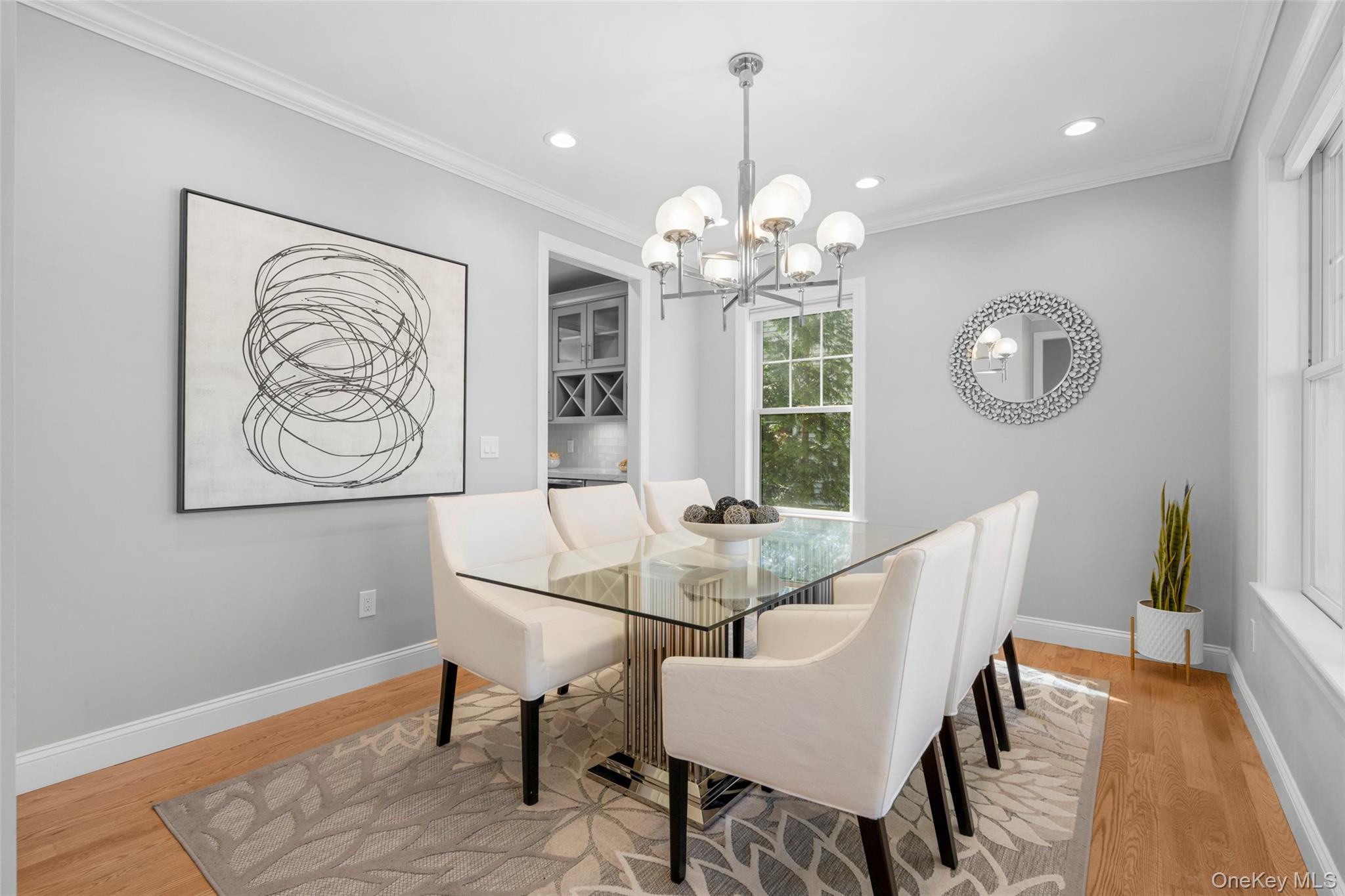 3 Robin Hill Road Scarsdale, NY 10583 - Photo 10 of 32 a view of a dining room with furniture wooden floor and a chandelier