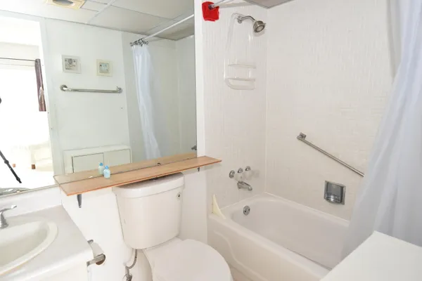 a bathroom with a sink a toilet and a bathtub