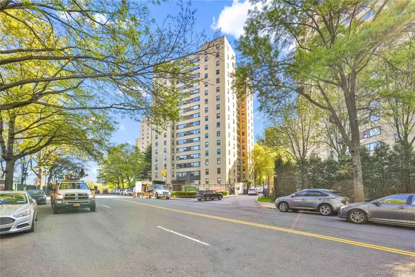 a view of street with parked cars
