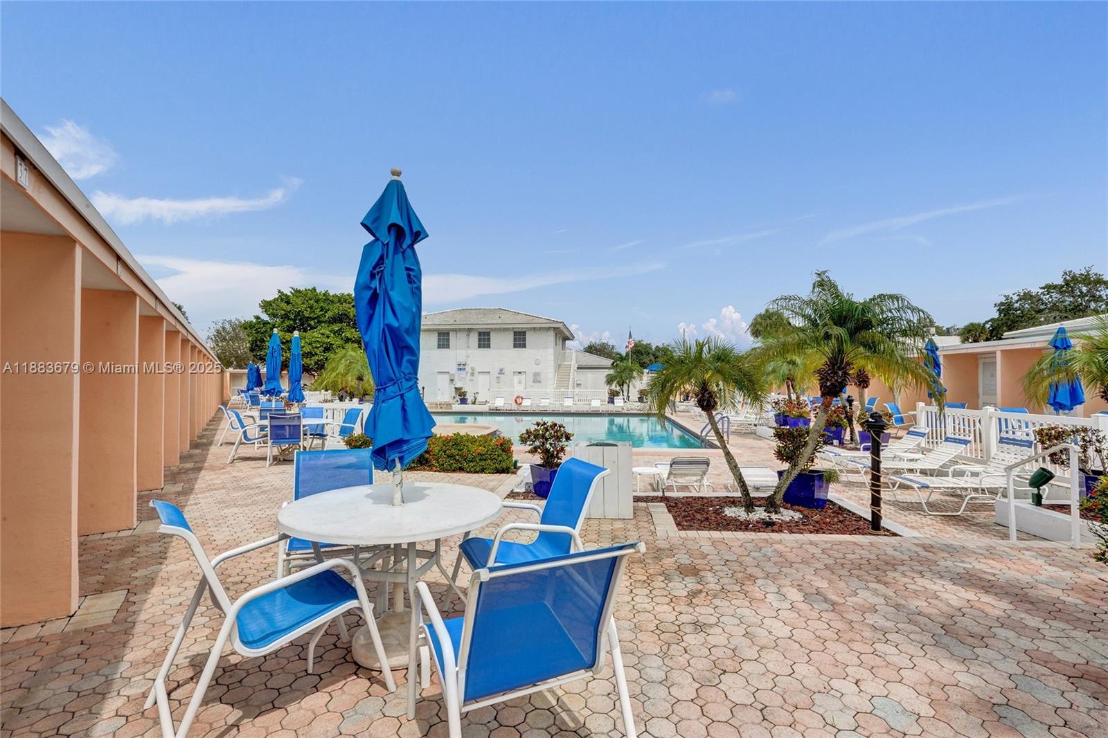 2181 Northeast 67th Street, Unit 622 Fort Lauderdale, FL 33308 - Photo 20 of 28 a view of a chairs and tables in patio
