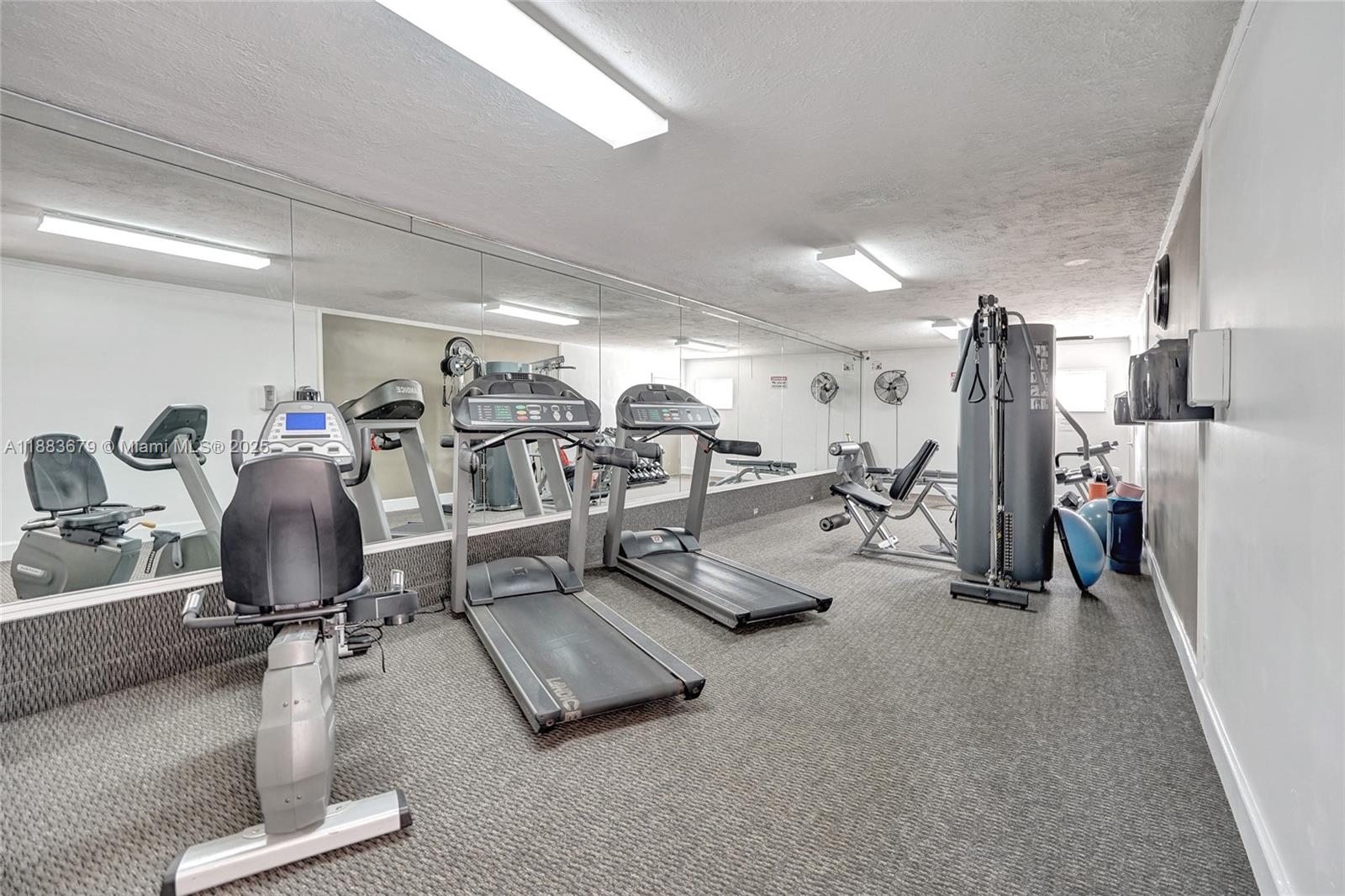 2181 Northeast 67th Street, Unit 622 Fort Lauderdale, FL 33308 - Photo 21 of 28 a view of a room with gym equipment