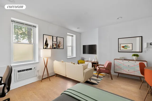 a kitchen with stainless steel appliances granite countertop a stove top oven a sink a refrigerator white cabinets and wooden floor