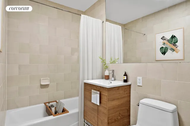 a bedroom with a bed and flat screen tv