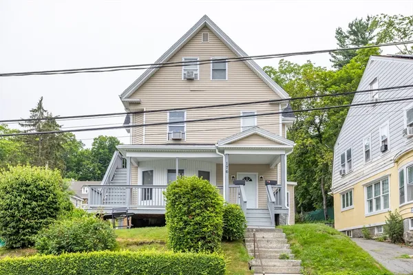 a front view of a house with a yard