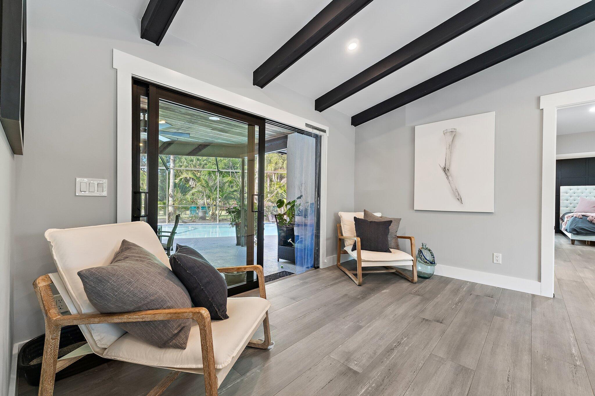 11845 165th Road North Jupiter, FL 33478 - Photo 19 of 68 a living room with furniture and a large window