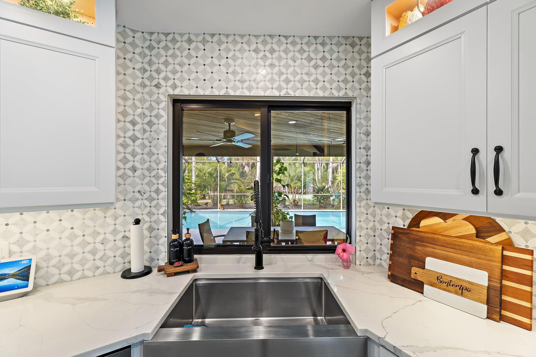 11845 165th Road North Jupiter, FL 33478 - Photo 27 of 68 a kitchen with a sink and a refrigerator