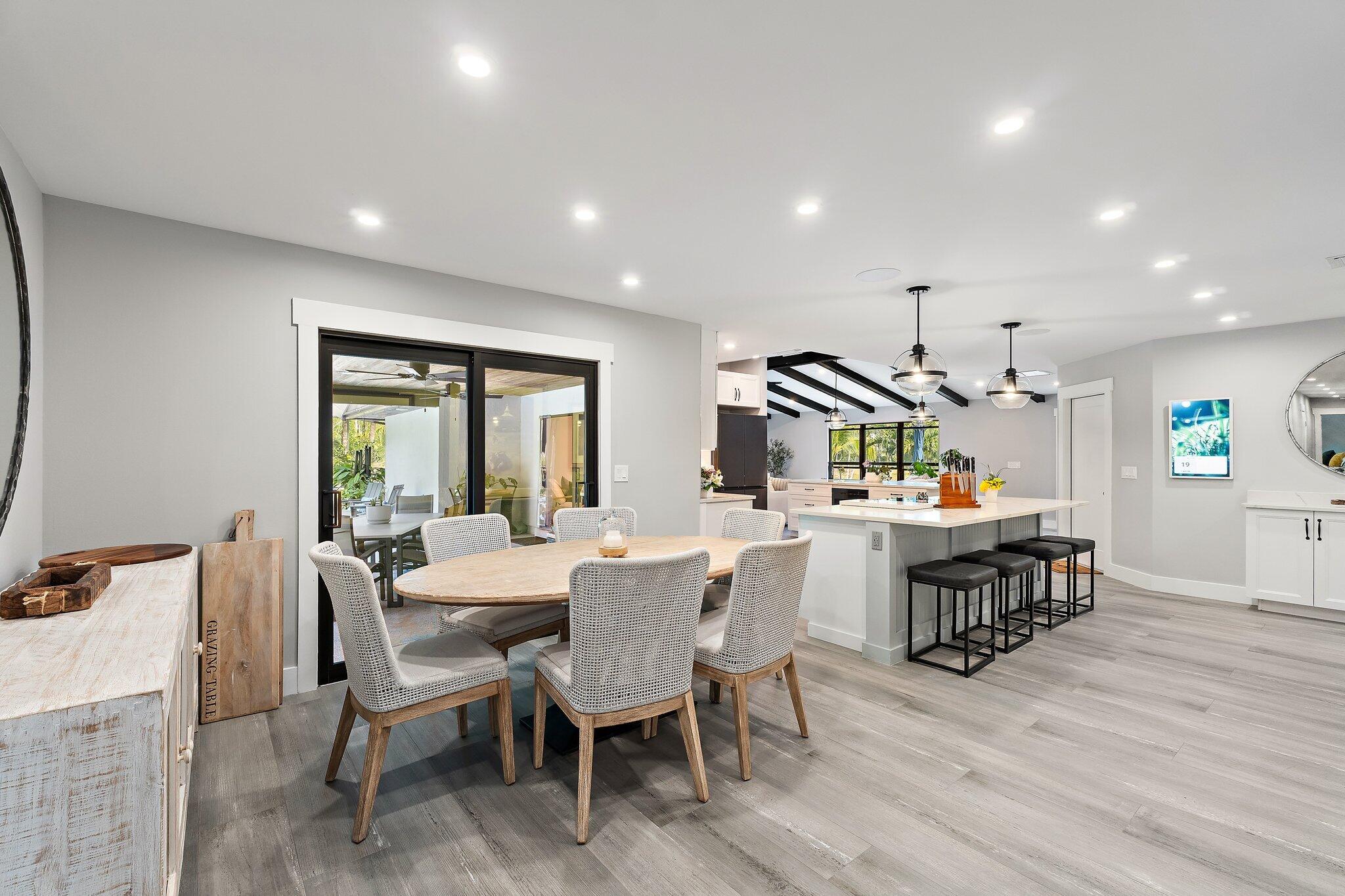 11845 165th Road North Jupiter, FL 33478 - Photo 31 of 68 a view of a dining room with furniture window and wooden floor