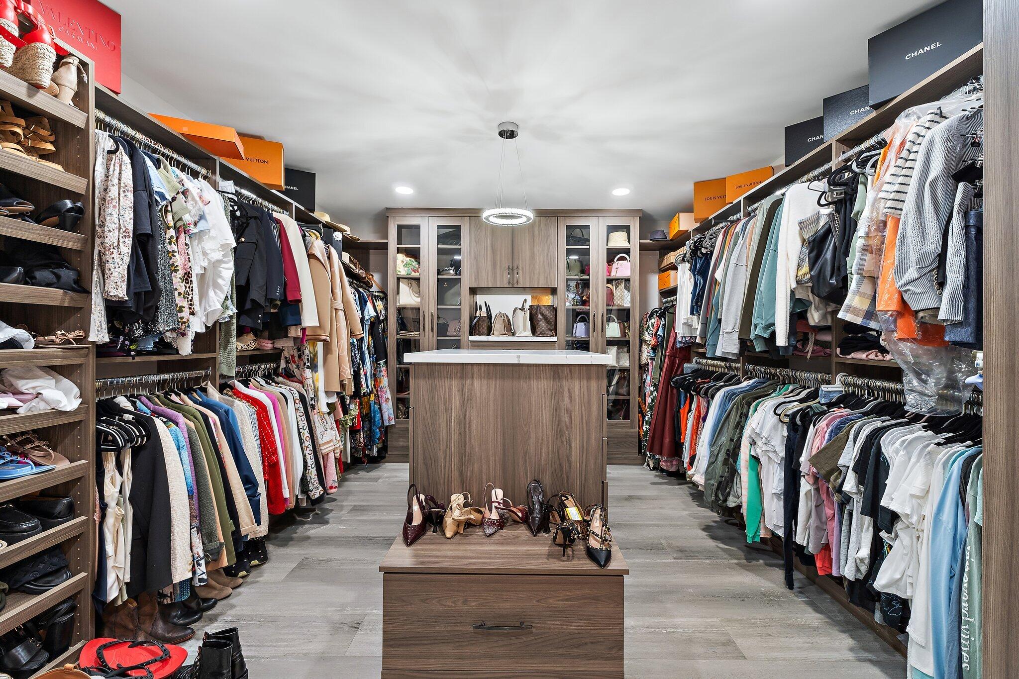 11845 165th Road North Jupiter, FL 33478 - Photo 33 of 68 a view of walk in closet with clothes and shoes