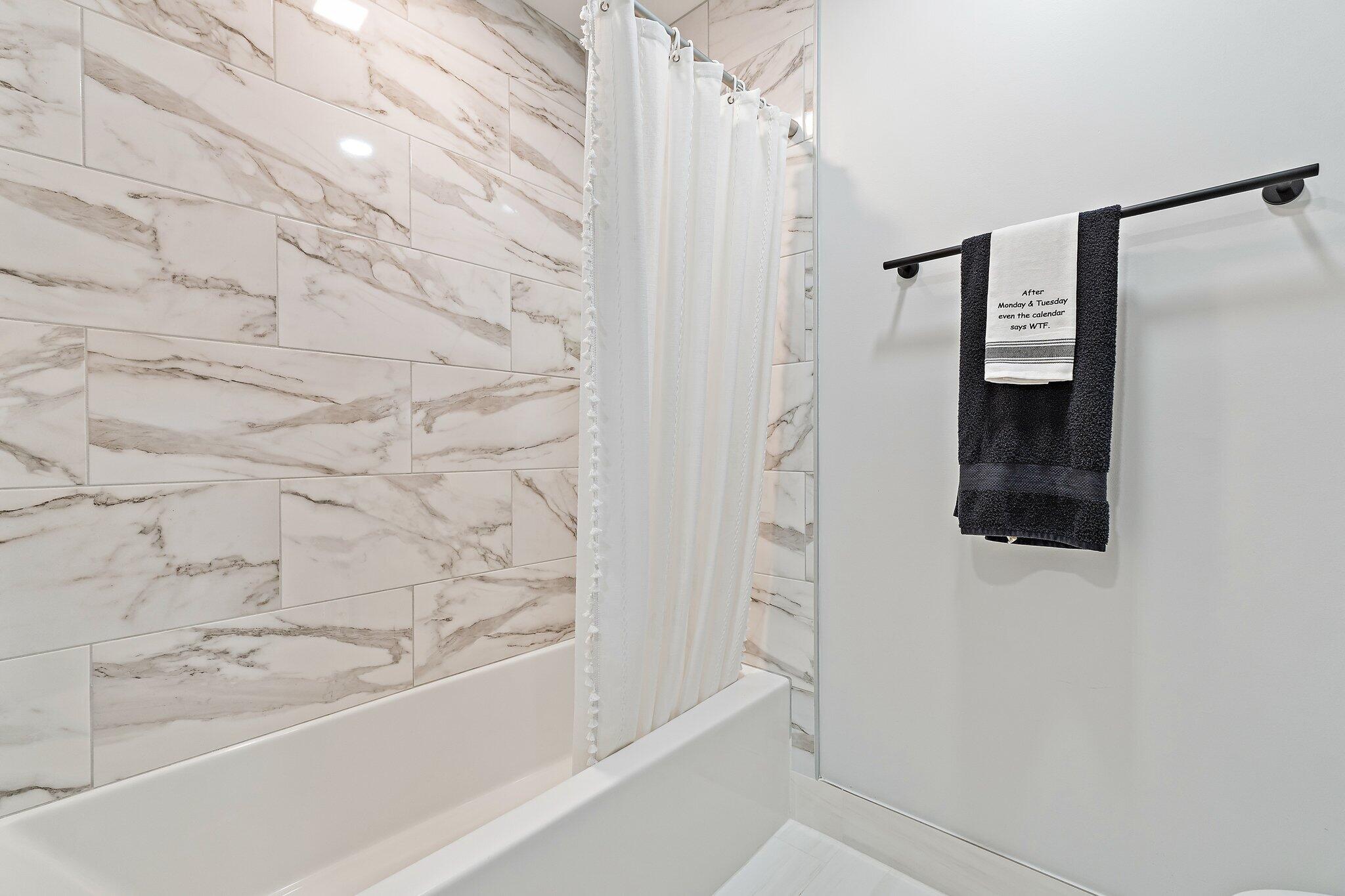 11845 165th Road North Jupiter, FL 33478 - Photo 43 of 68 a bathroom with a bathtub and shower