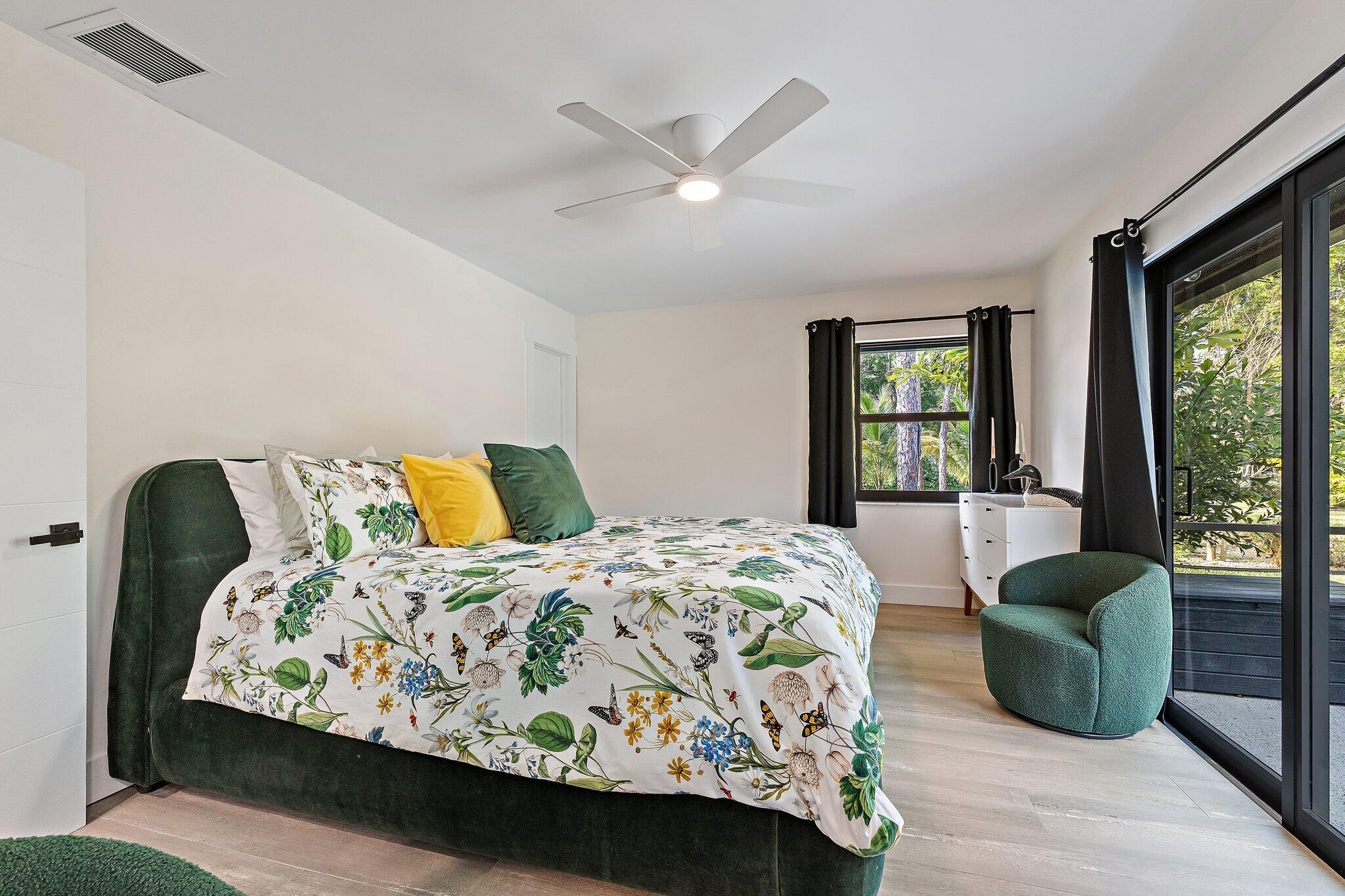 11845 165th Road North Jupiter, FL 33478 - Photo 45 of 68 a bedroom with a bed window and couch