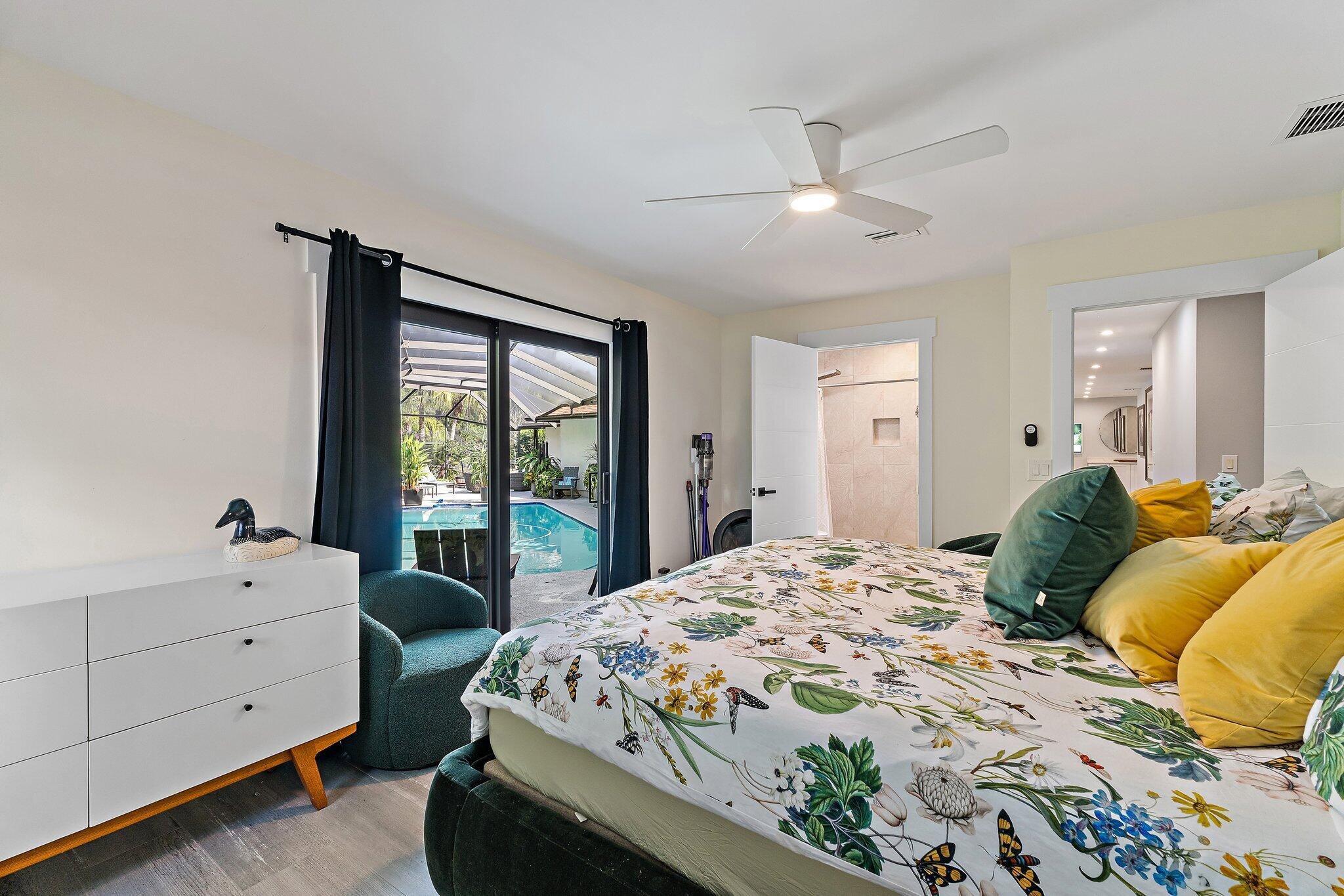 11845 165th Road North Jupiter, FL 33478 - Photo 46 of 68 a bedroom with a bed and a large window