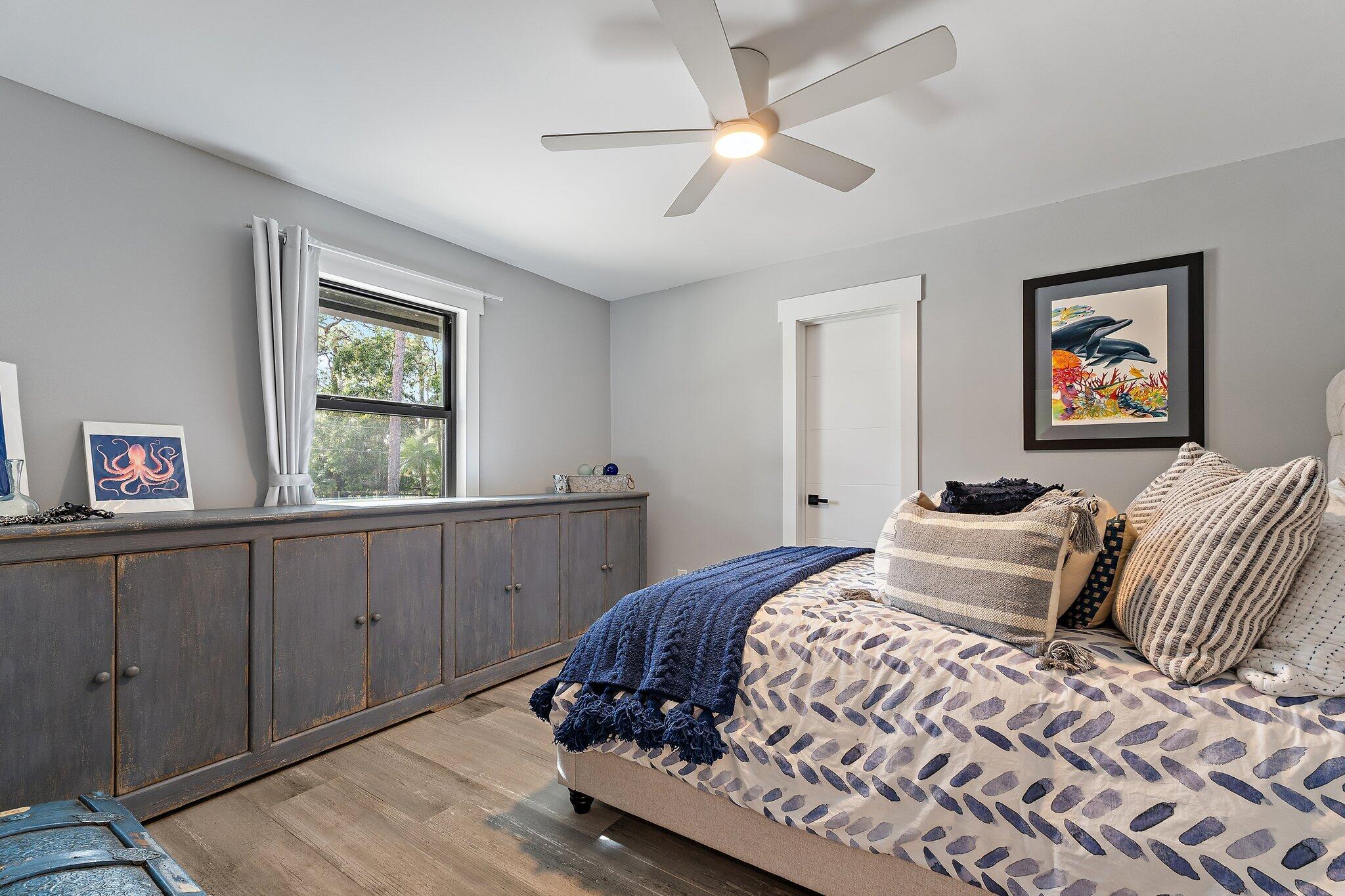 11845 165th Road North Jupiter, FL 33478 - Photo 49 of 68 a bedroom with a large bed and a window