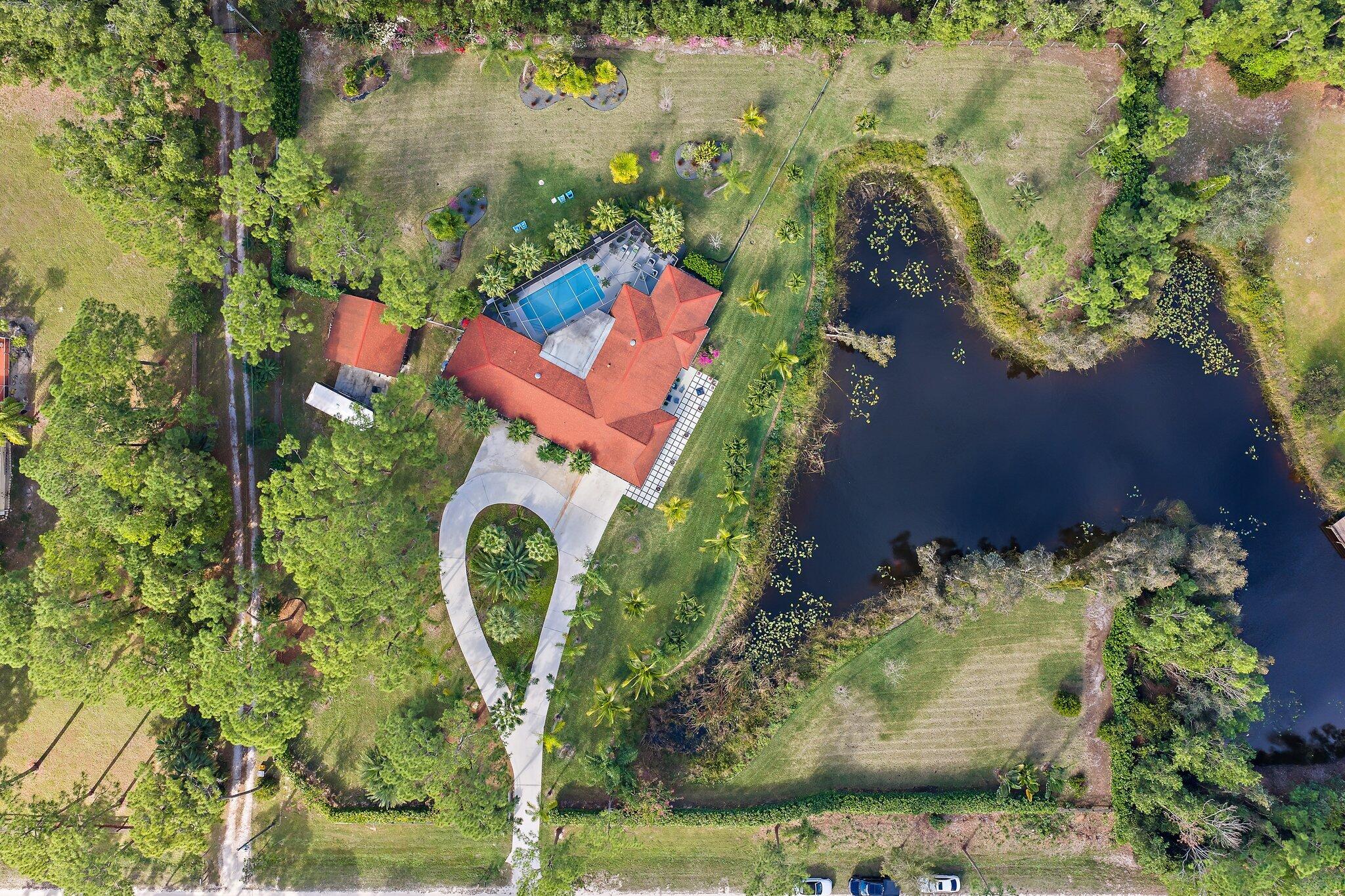 11845 165th Road North Jupiter, FL 33478 - Photo 5 of 68 an aerial view of a house with outdoor space