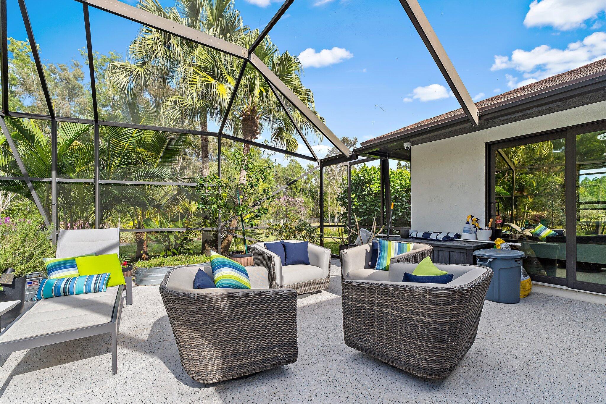 11845 165th Road North Jupiter, FL 33478 - Photo 59 of 68 a living room with furniture and a potted plant