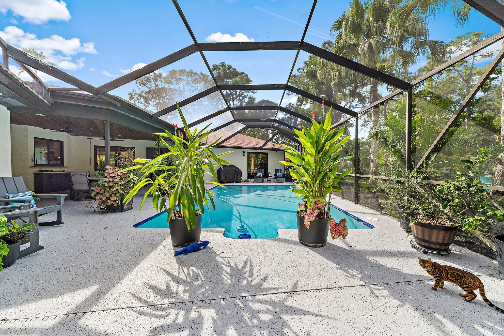 11845 165th Road North Jupiter, FL 33478 - Photo 60 of 68 a vase of flowers sitting on a table