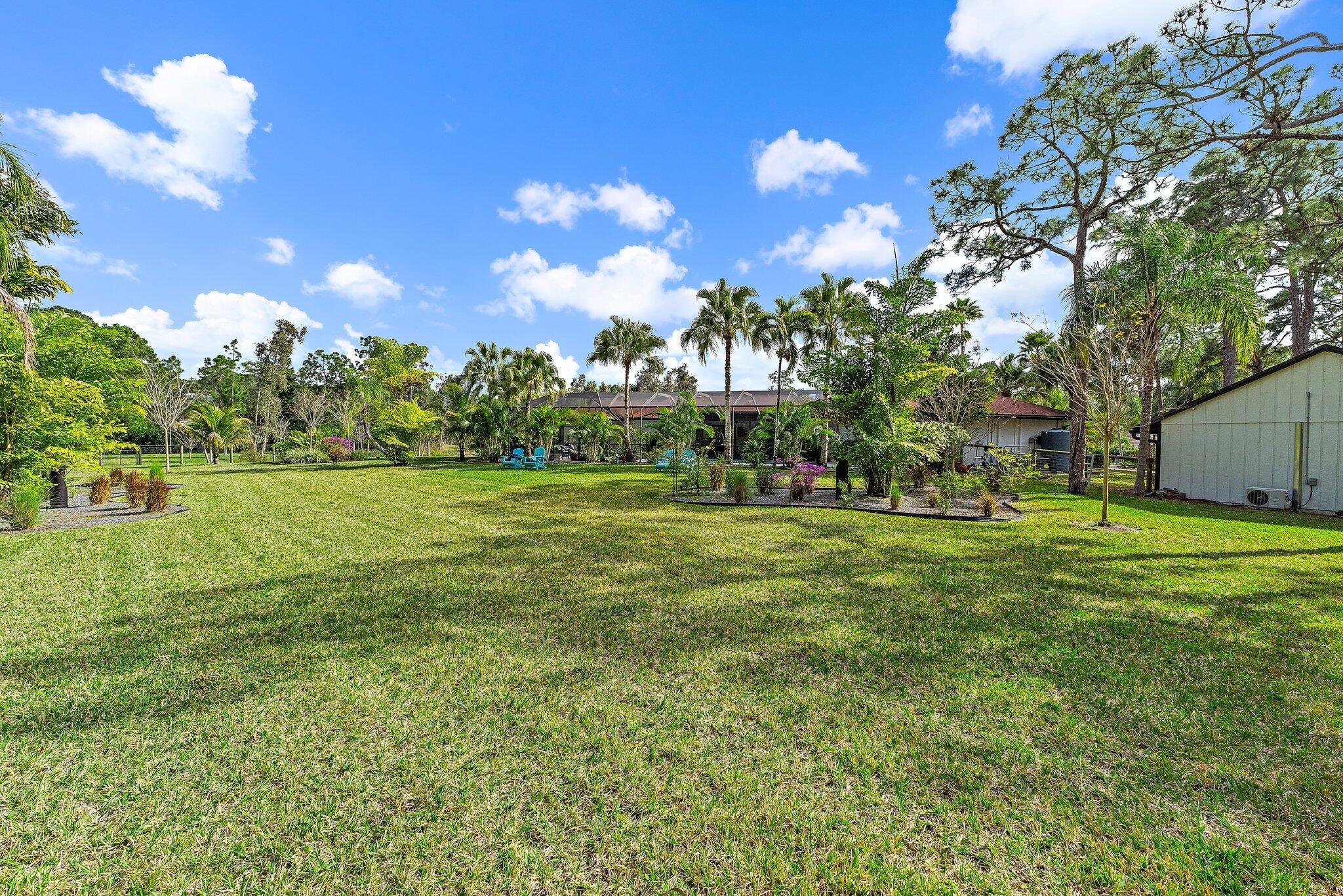 11845 165th Road North Jupiter, FL 33478 - Photo 64 of 68 a view of a building with a big yard