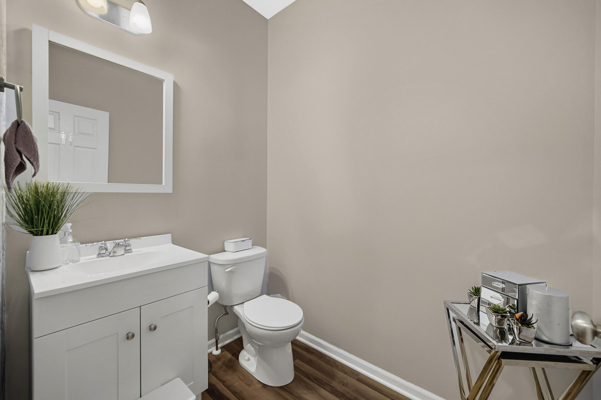 12728 Ellsworth Street Crown Point, IN 46307 - Photo 11 of 30 a bathroom with a toilet sink and mirror