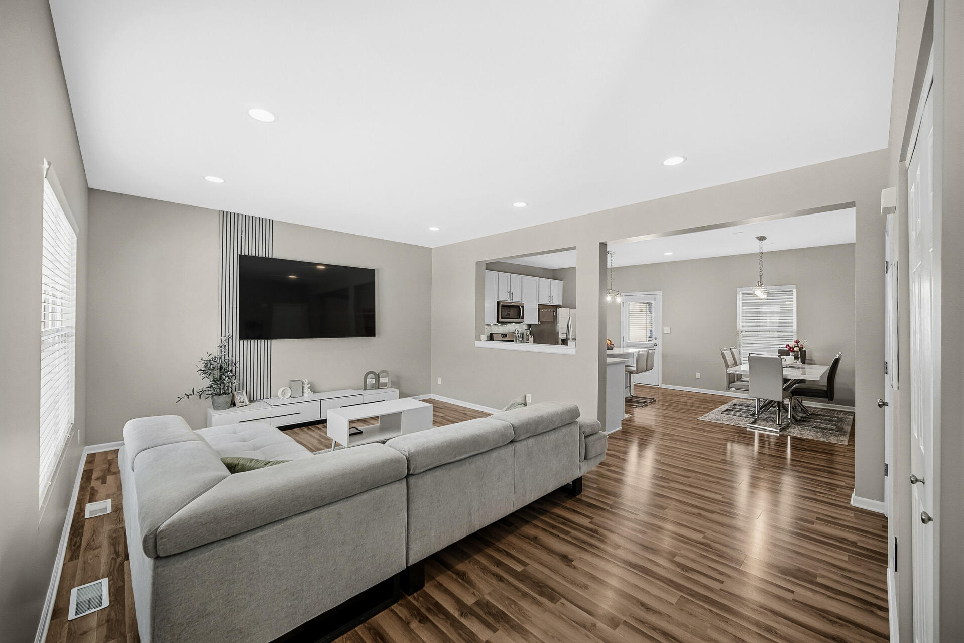 12728 Ellsworth Street Crown Point, IN 46307 - Photo 13 of 30 a living room with furniture and a flat screen tv