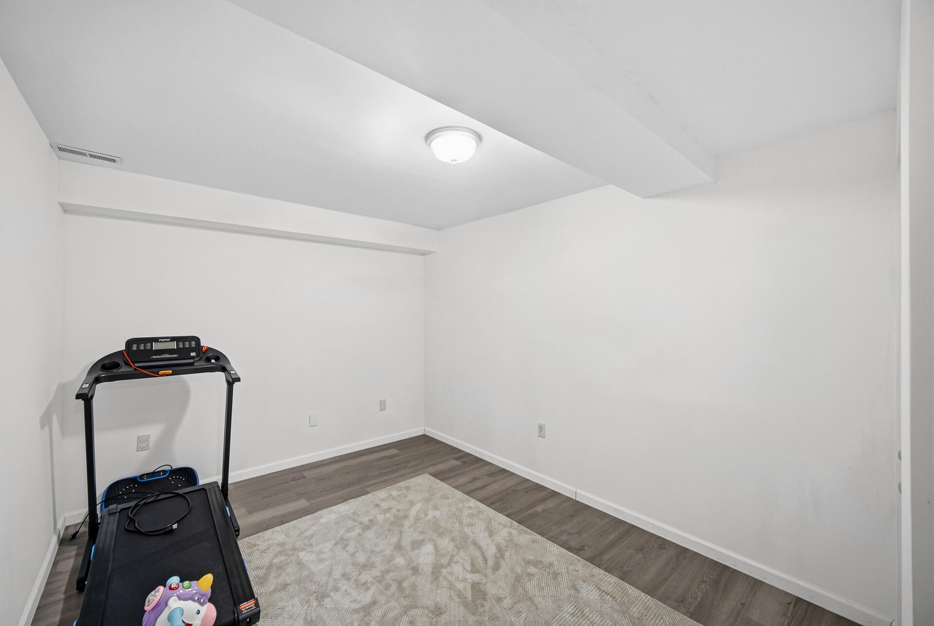 12728 Ellsworth Street Crown Point, IN 46307 - Photo 23 of 30 an empty room with wooden floor and closet