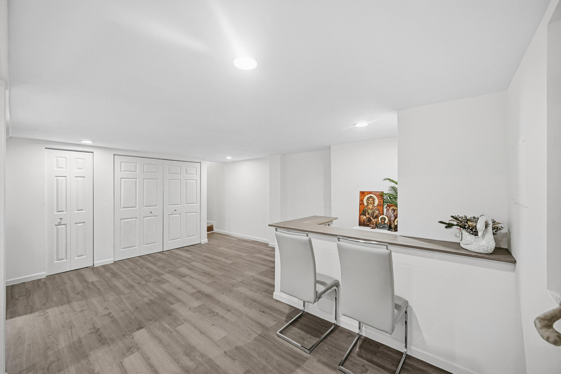 12728 Ellsworth Street Crown Point, IN 46307 - Photo 25 of 30 a workspace with a table chair and wooden floor
