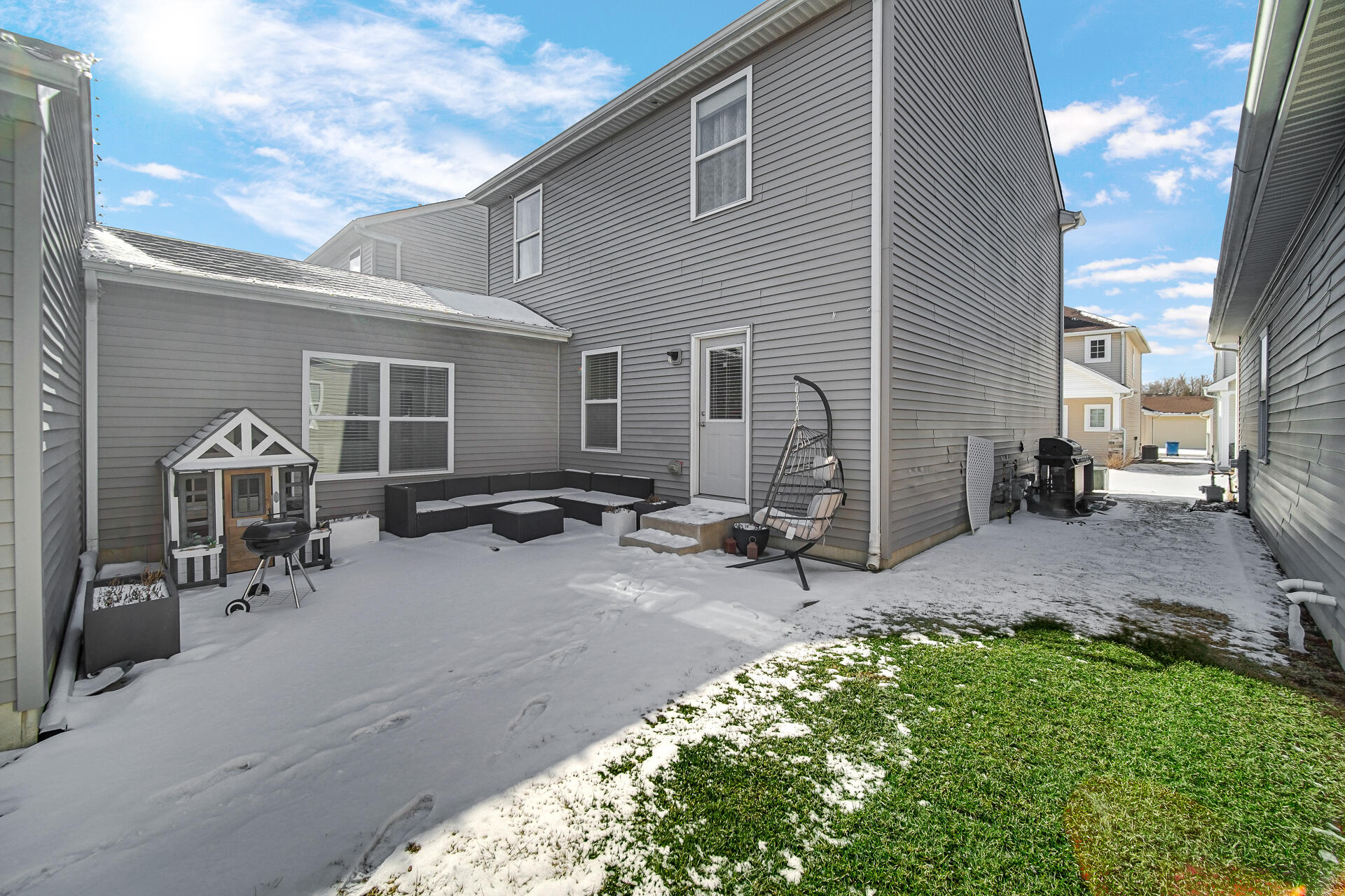 12728 Ellsworth Street Crown Point, IN 46307 - Photo 28 of 30 a view of a patio with table and chairs and a barbeque