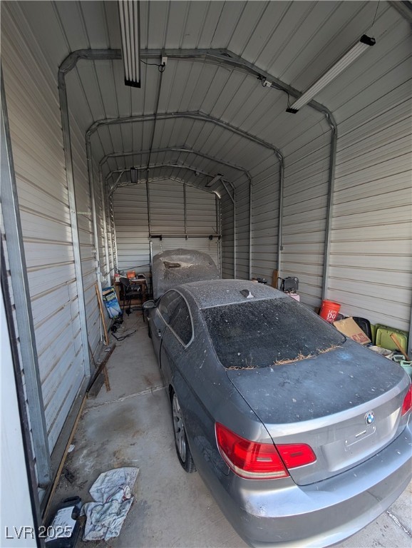 104 Appian Way Henderson, NV 89002 - Photo 18 of 52 Garage featuring a carport