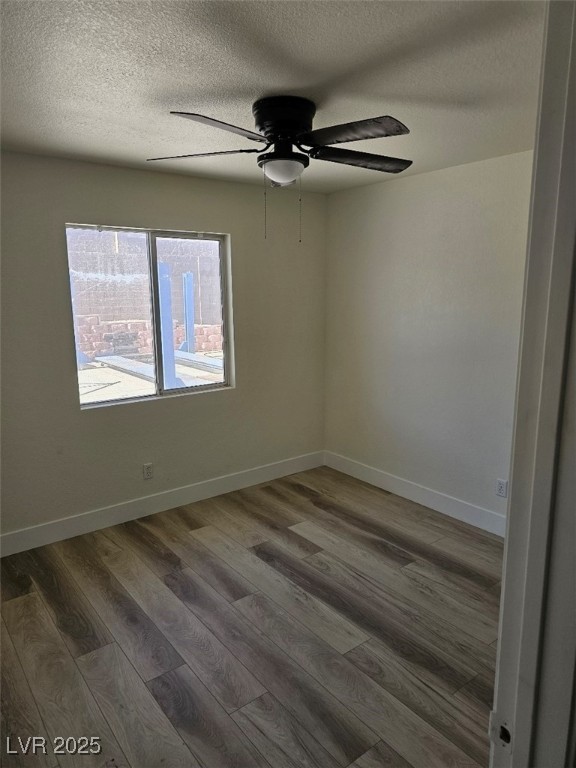104 Appian Way Henderson, NV 89002 - Photo 29 of 52 Spare room featuring wood finished floors, a textured ceiling, and ceiling fan