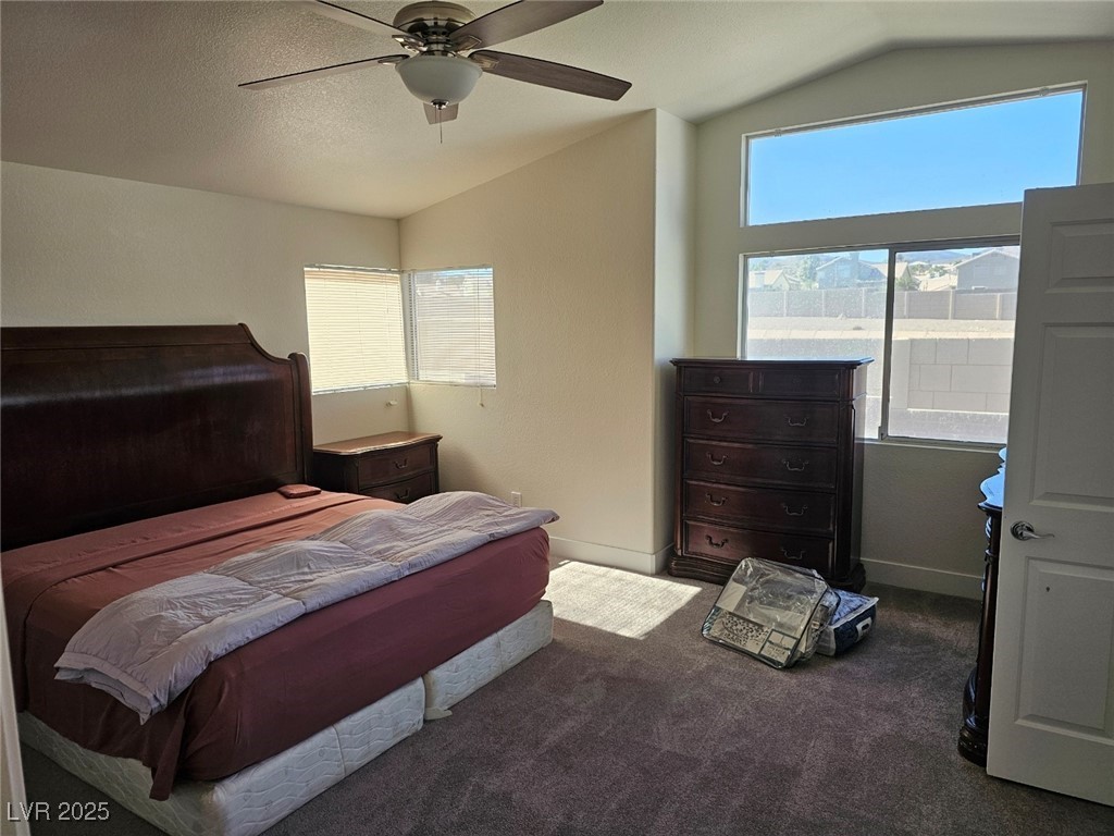 104 Appian Way Henderson, NV 89002 - Photo 36 of 52 Bedroom with vaulted ceiling, carpet, and ceiling fan