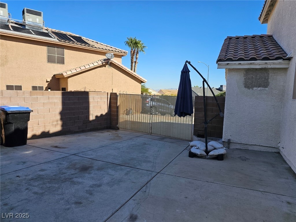 104 Appian Way Henderson, NV 89002 - Photo 37 of 52 Fenced backyard with a patio area and a gate