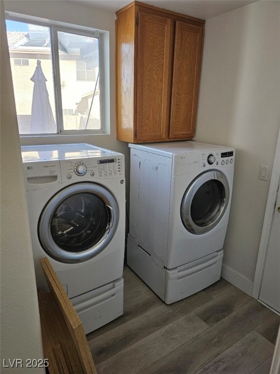 104 Appian Way Henderson, NV 89002 - Photo 38 of 52 Washroom with cabinet space, light wood finished floors, and washer and clothes dryer