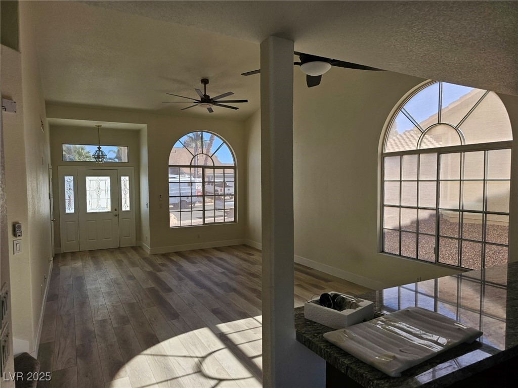 104 Appian Way Henderson, NV 89002 - Photo 39 of 52 Entrance foyer with dark wood-style flooring, plenty of natural light, ceiling fan, and a textured ceiling