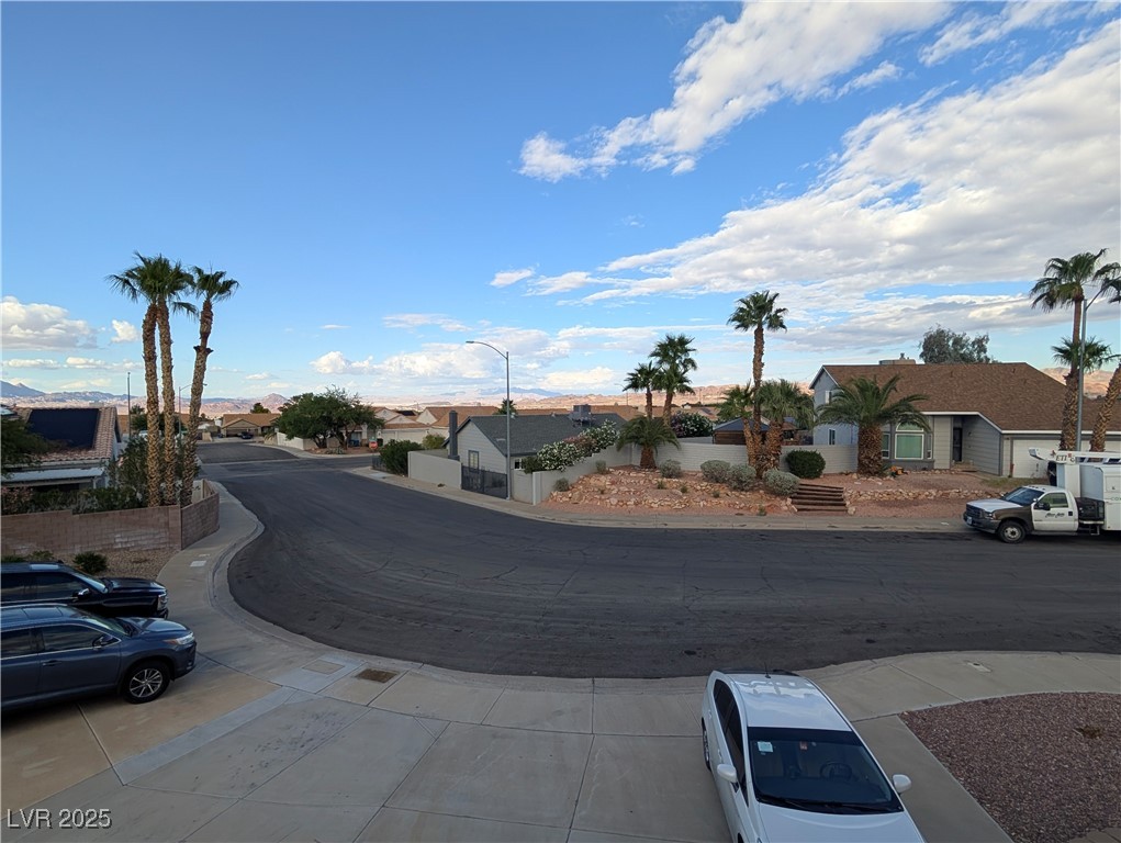 104 Appian Way Henderson, NV 89002 - Photo 6 of 52 View of road featuring a residential view and street lighting