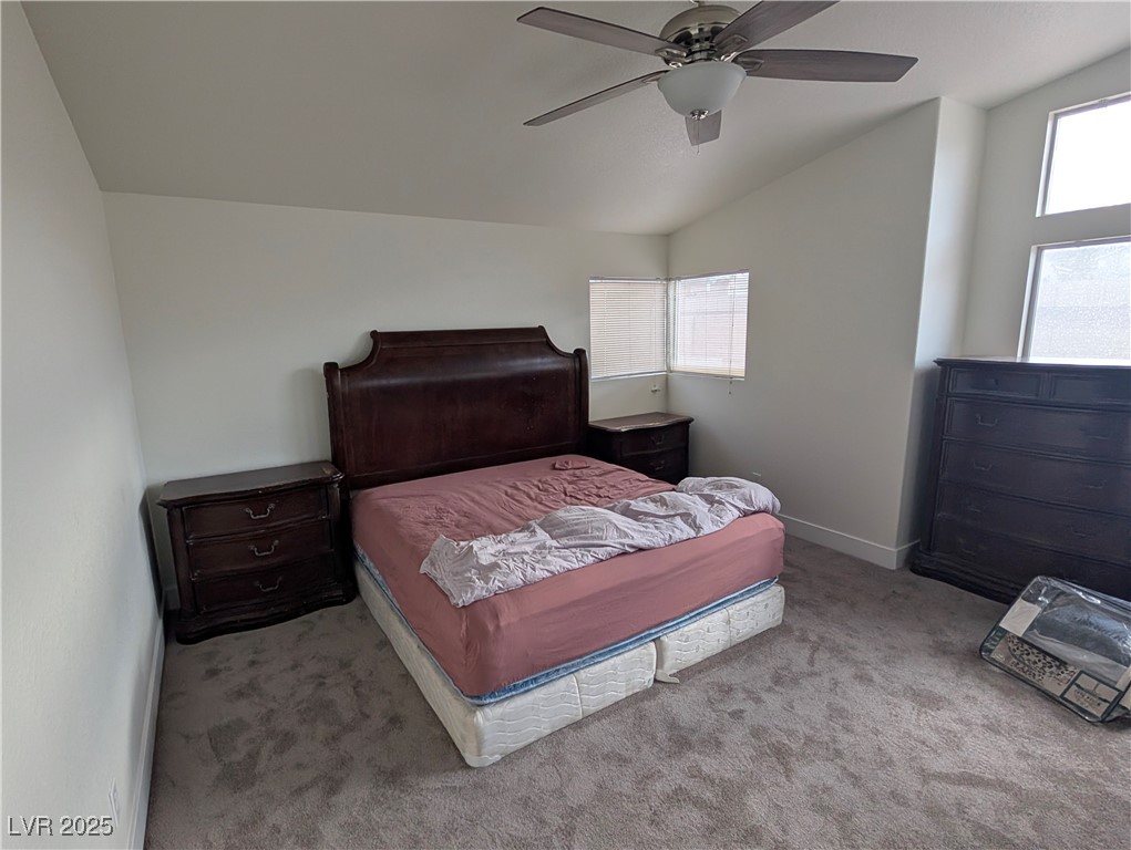 104 Appian Way Henderson, NV 89002 - Photo 7 of 52 Bedroom featuring vaulted ceiling, carpet flooring, and ceiling fan