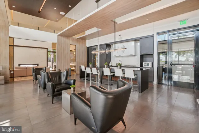 a view of a livingroom with furniture and gym equipment