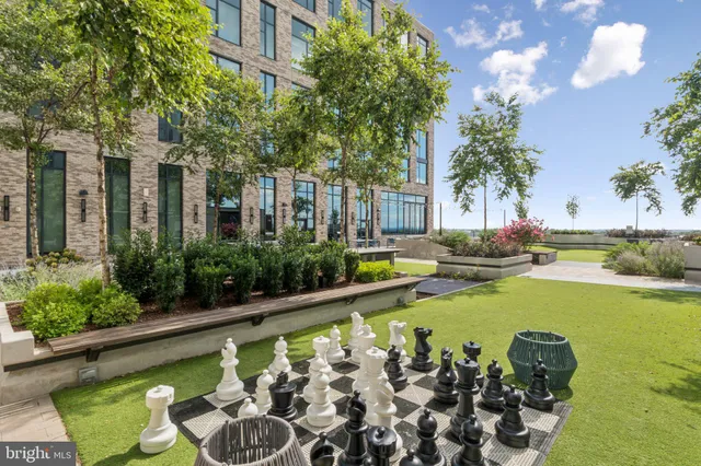 a swimming pool with outdoor seating