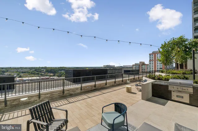 a view of swimming pool with outdoor seating and plants