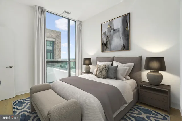 a kitchen with stainless steel appliances a stove and a wooden cabinets