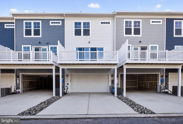 a front view of a building with many windows