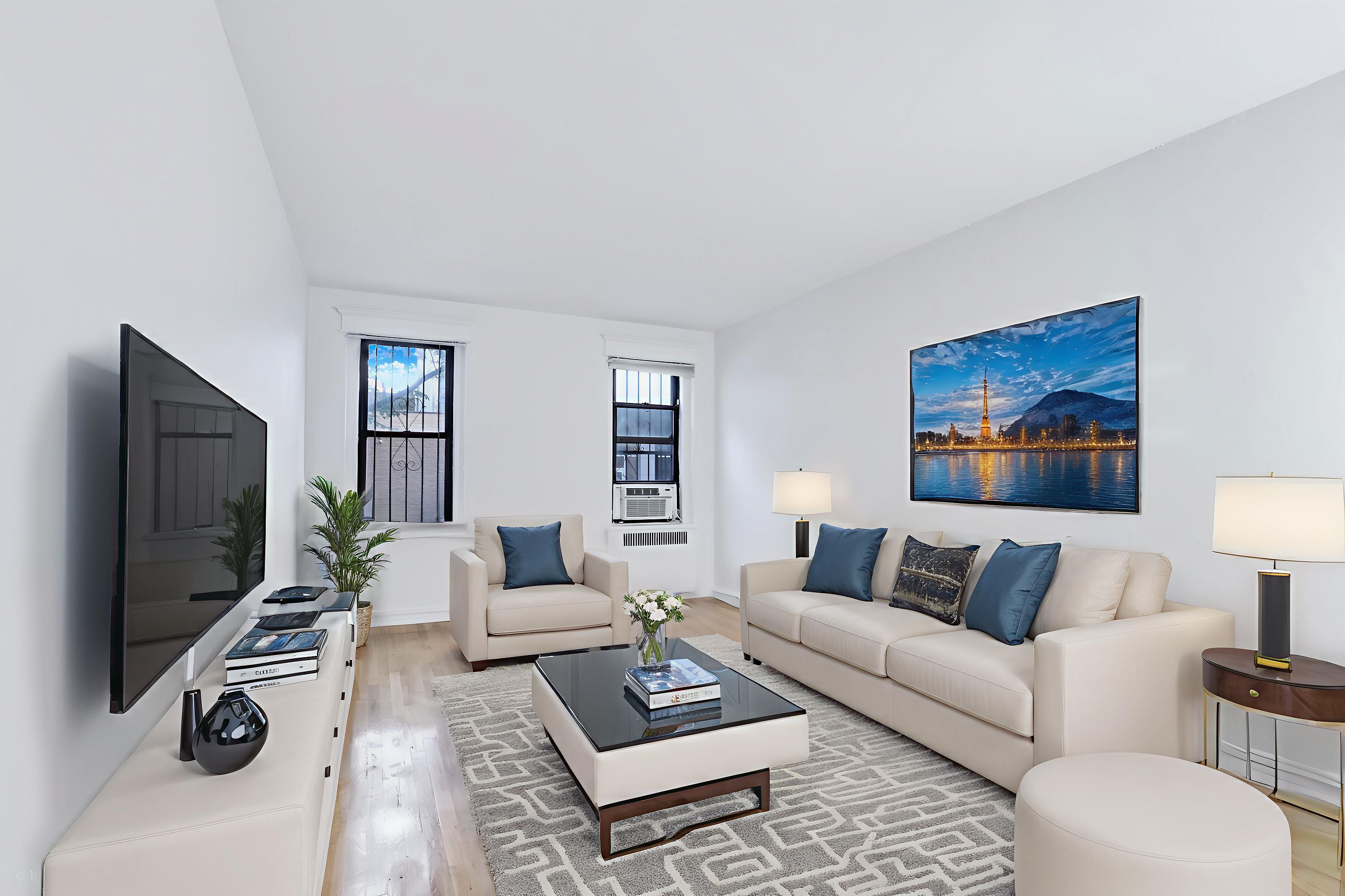 1 West 126th Street, Unit 1C Manhattan, NY 10027 - Photo 3 of 11 a living room with furniture a rug and a flat screen tv