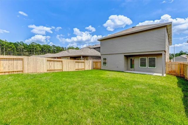 a backyard of a house with lots of green space
