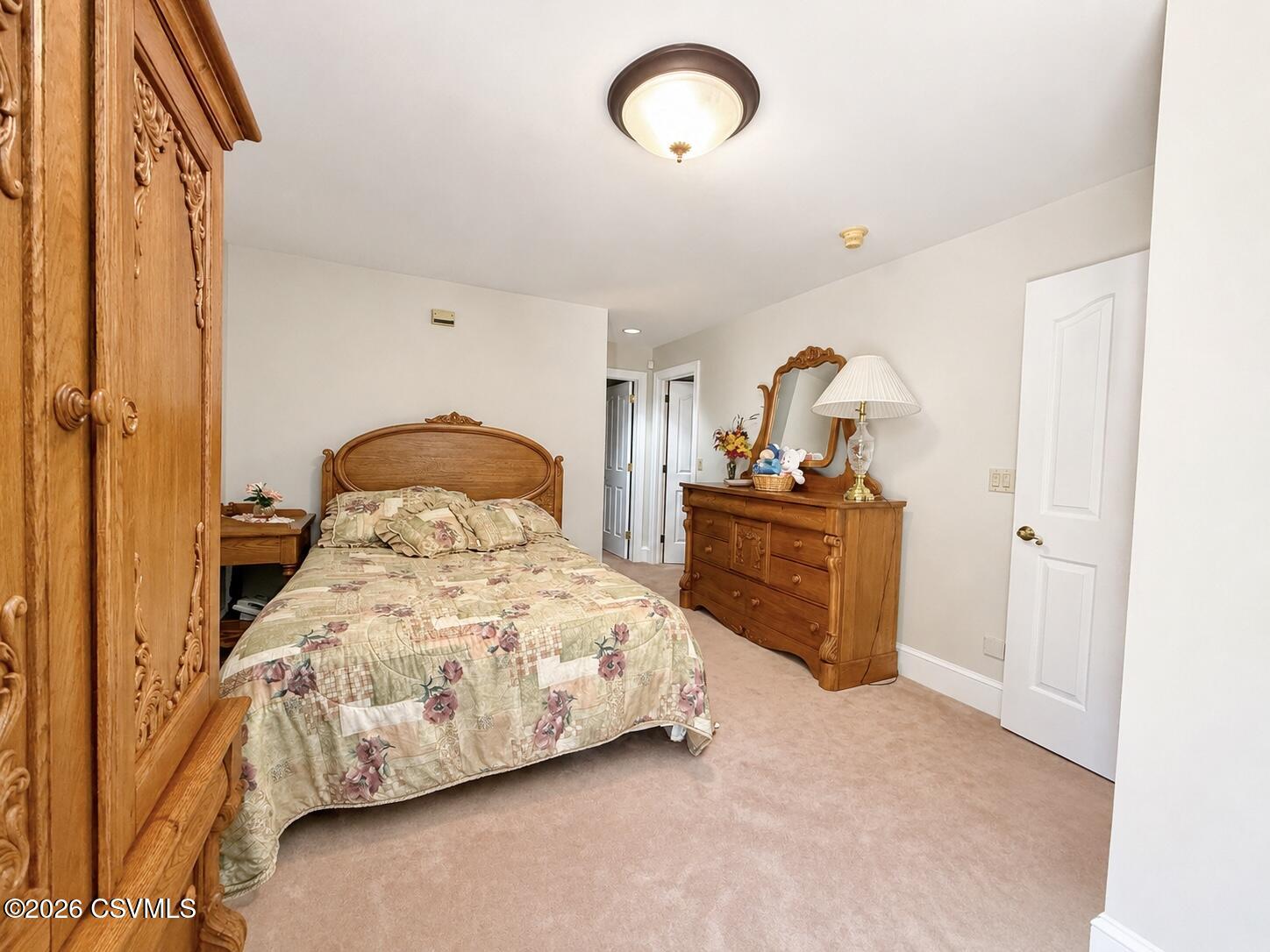 50 Sweet Gum Road Selinsgrove, PA 17870 - Photo 51 of 82 a bedroom with a bed and a chandelier