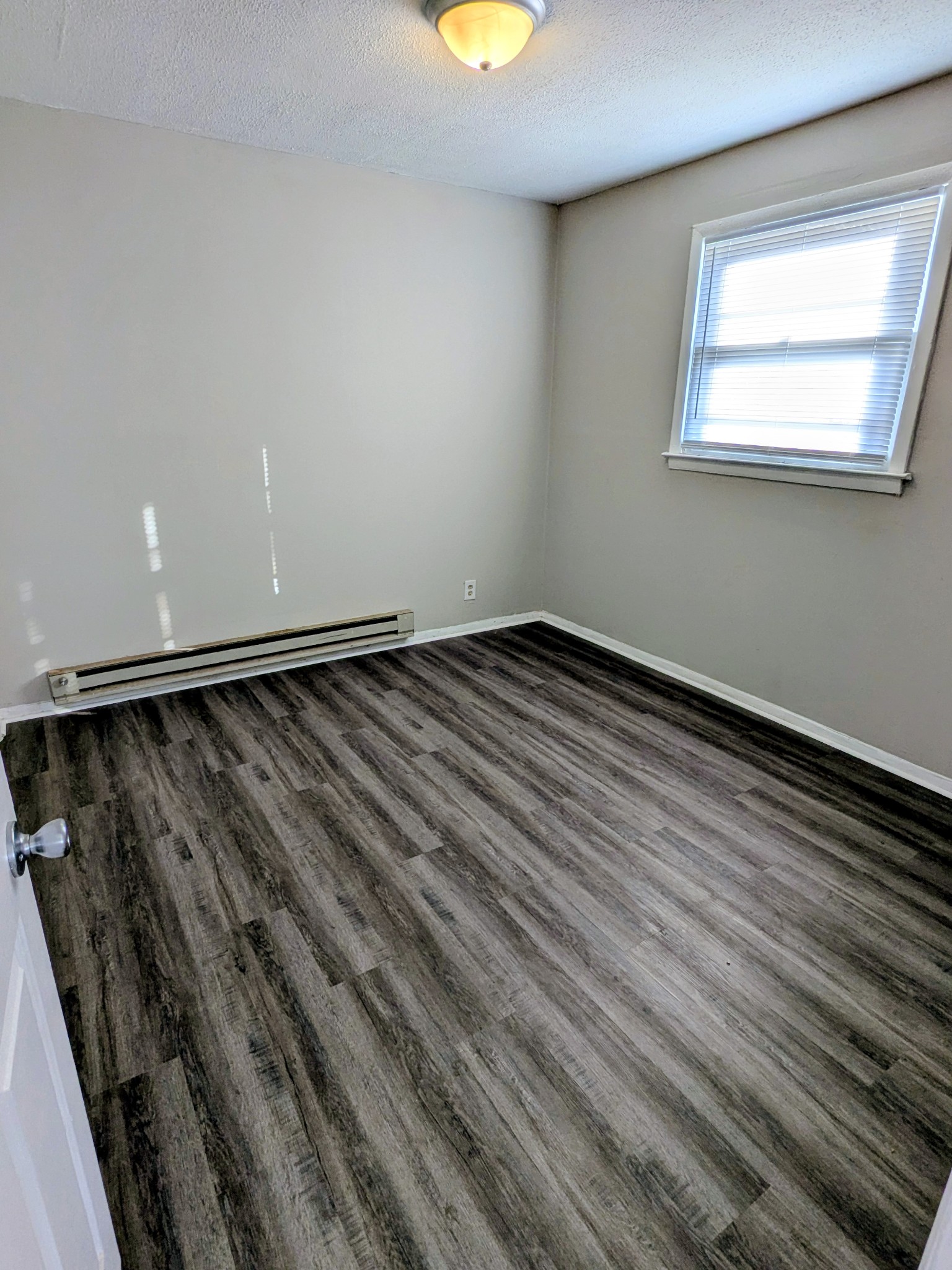 118 Rains Avenue, Unit 1 Nashville, TN 37203 - Photo 2 of 7 a view of an empty room and window