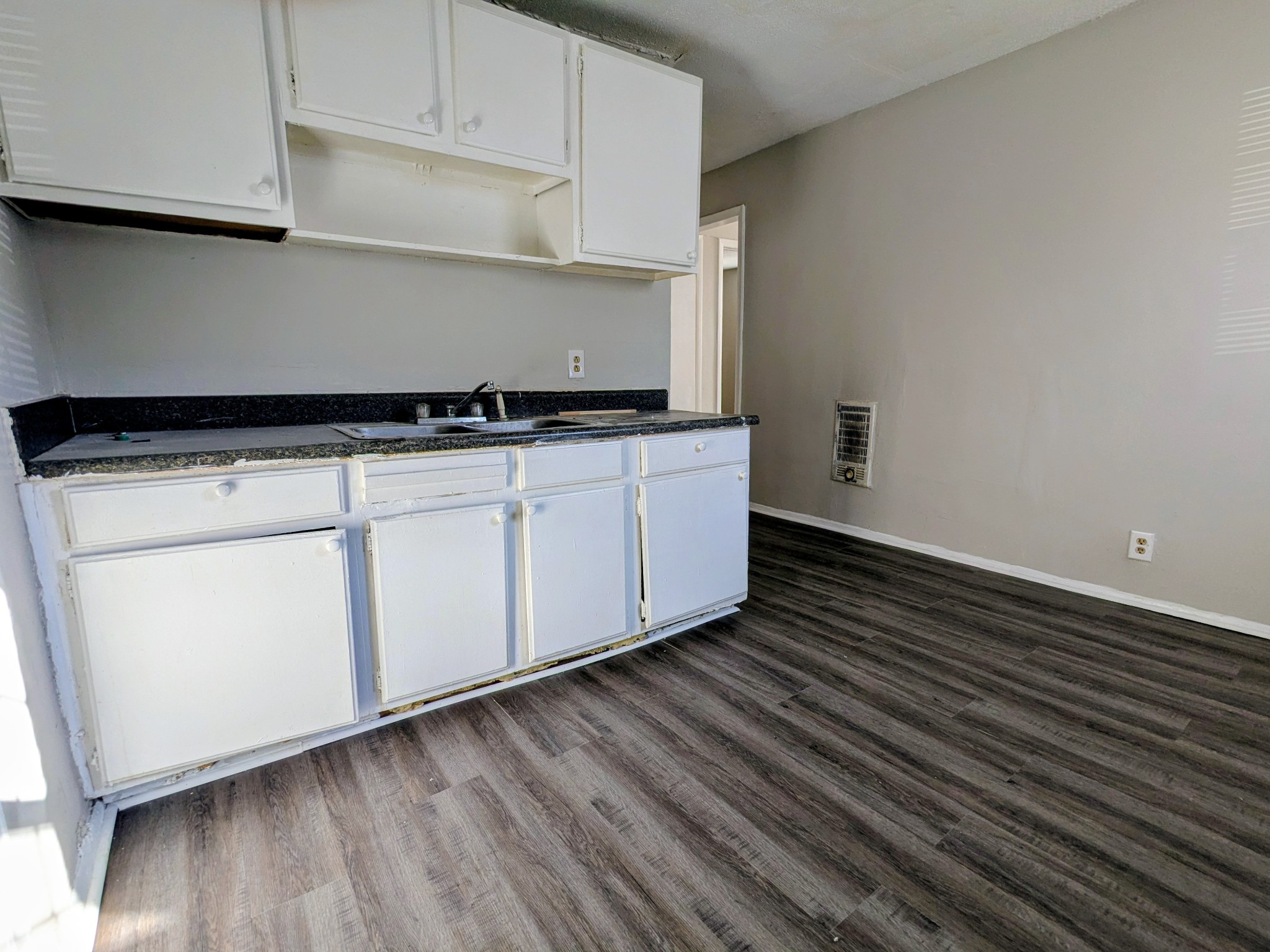 118 Rains Avenue, Unit 1 Nashville, TN 37203 - Photo 4 of 7 a kitchen with cabinets and wooden floor